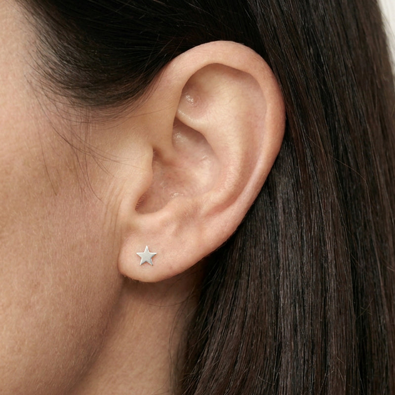 ‘Midnight’ Sterling Silver Tiny Moon and Star Stud Earring, worn