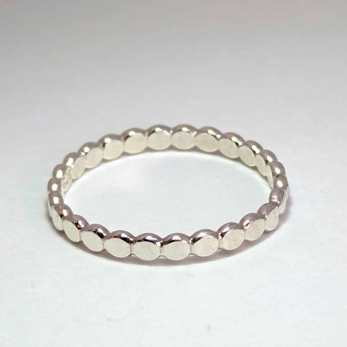 A handmade sterling silver Stepping Stones stacker ring