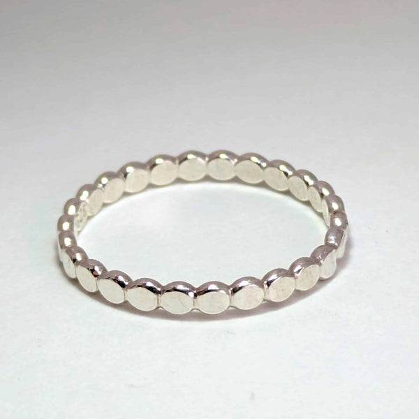 A handmade sterling silver Stepping Stones stacker ring
