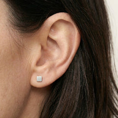 'Equal' Sterling Silver Tiny Square Stud Earring, worn, view 2