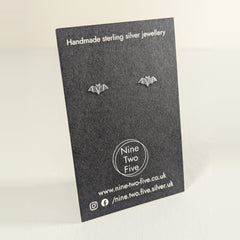 'Nocturna' Tiny Bat Sterling Silver Studs on the Nine Two Five earring card, view 2