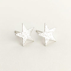 'Fallen Star' Sterling Silver Textured Medium Star Stud Earring, view 1