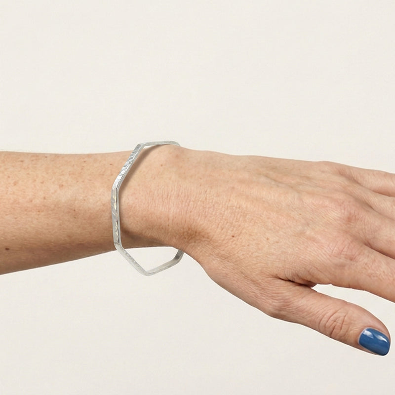 'Octangle' Sterling Silver Slim Octagonal Shaped Hammered Bangle, worn
