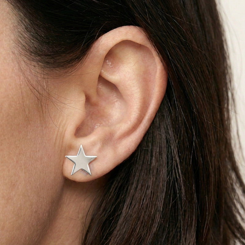 'Fallen Star' Sterling Silver Large Polished Star Stud Earring, worn