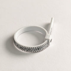 Adjustable ring sizer formed into a ring, UK sizes A to Z, view 1