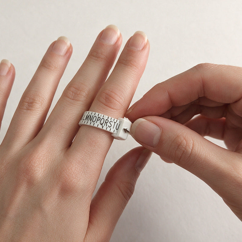 Ring sizer worn on the finger and adjusted to fit